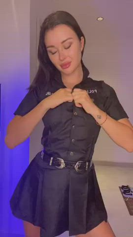 She can't resist teasing you in her snap button uniform