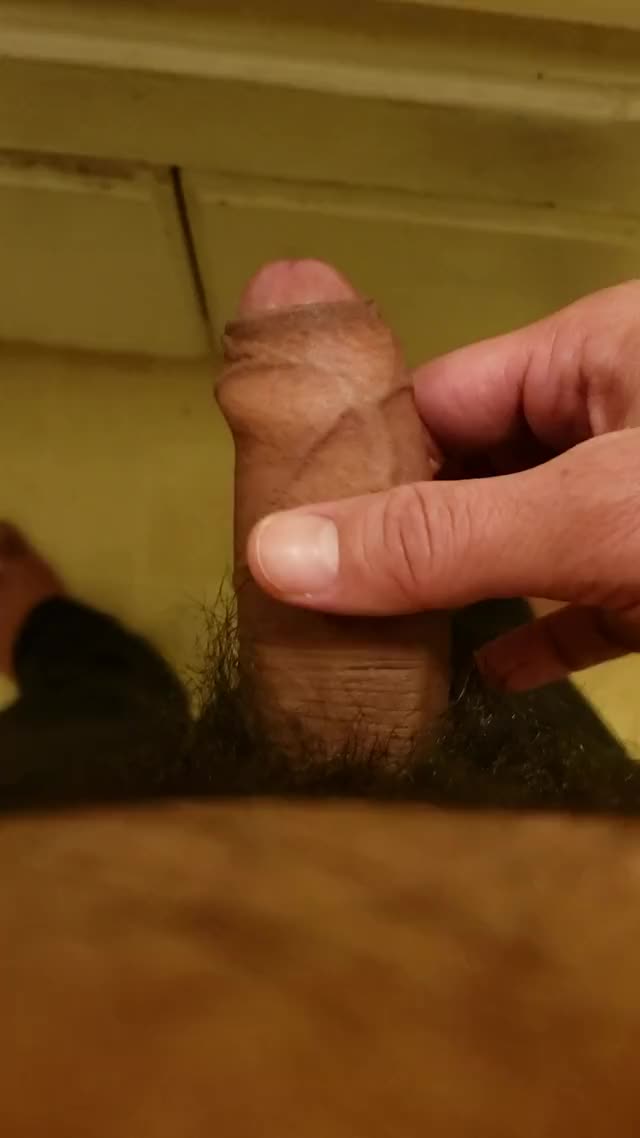 Pulling my foreskin up and down on my cock