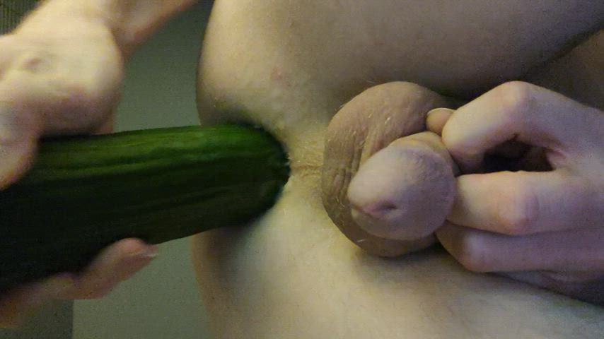 Stretching myself with a huge cucumber.
