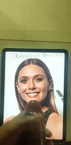 Huge cumblast on Elizabeth Olsen 's face, massive cumtribute.