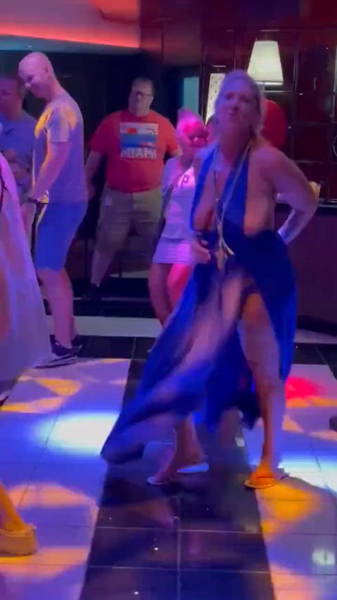 A wife dancing at a work function party