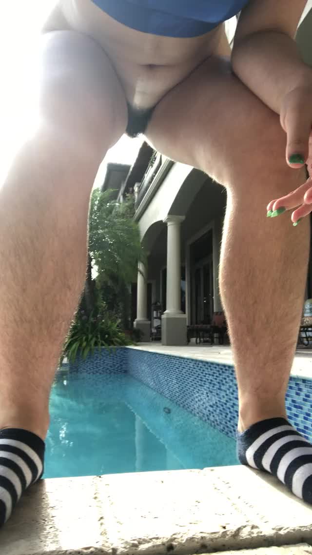 hairy bitch pisses in the pool