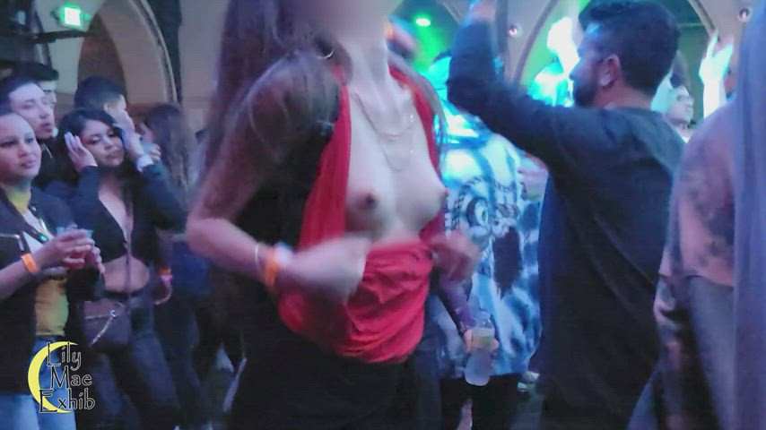 Tits slipped out on the crowded dance floor!