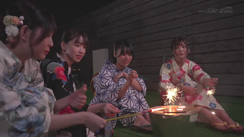 4 friends enjoy sparklers