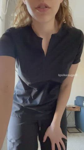 Stripping out of her scrubs