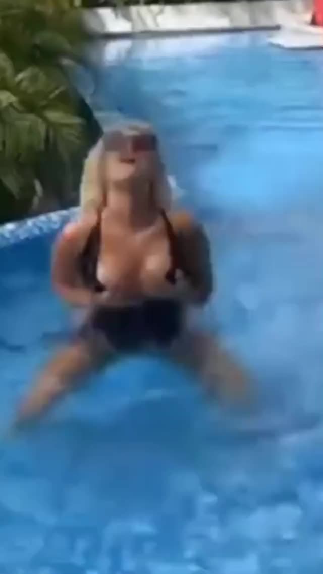 Bebe Rexha dancing in the pool