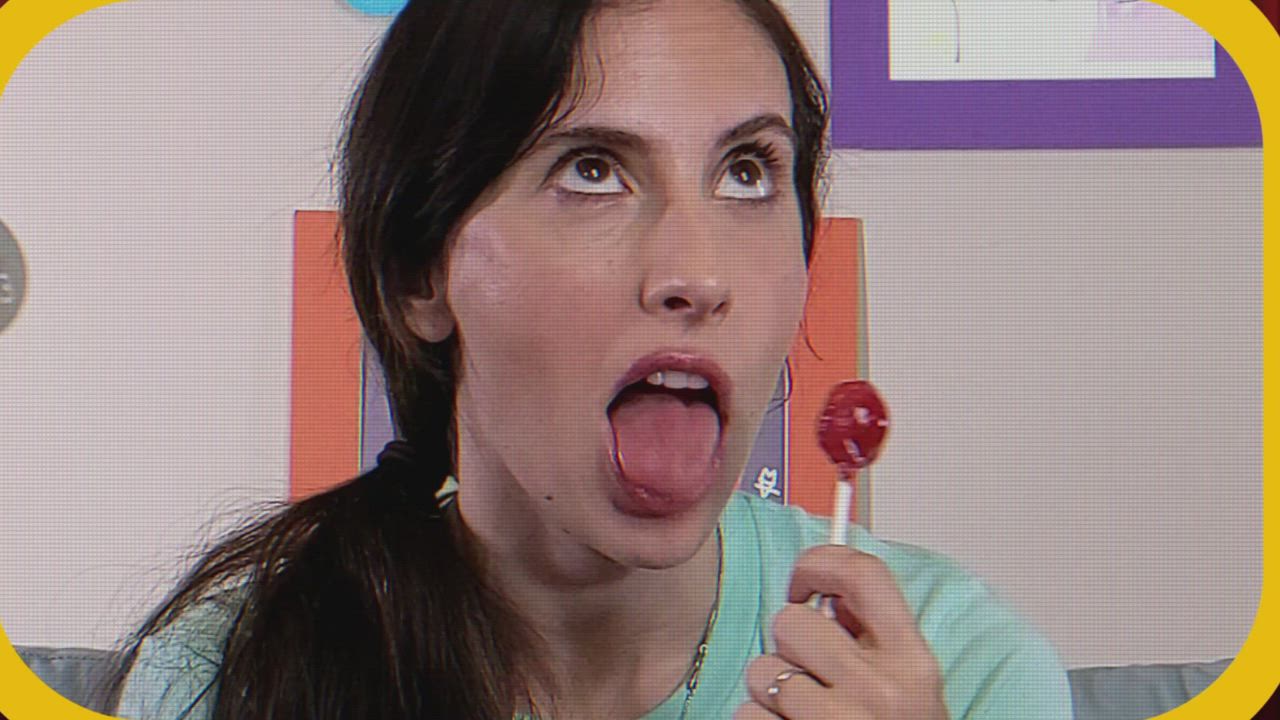 Stephanie licking and savoring a lollipop...