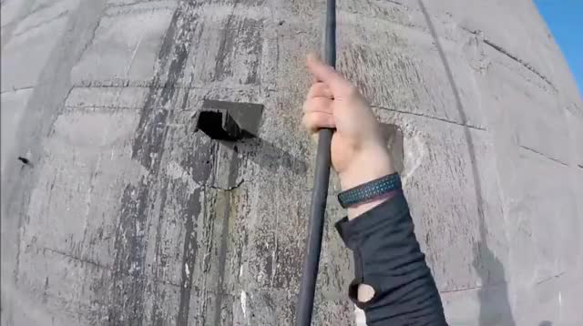 Scaling 21 meters up a chimney using old electric cable to get access to the top
