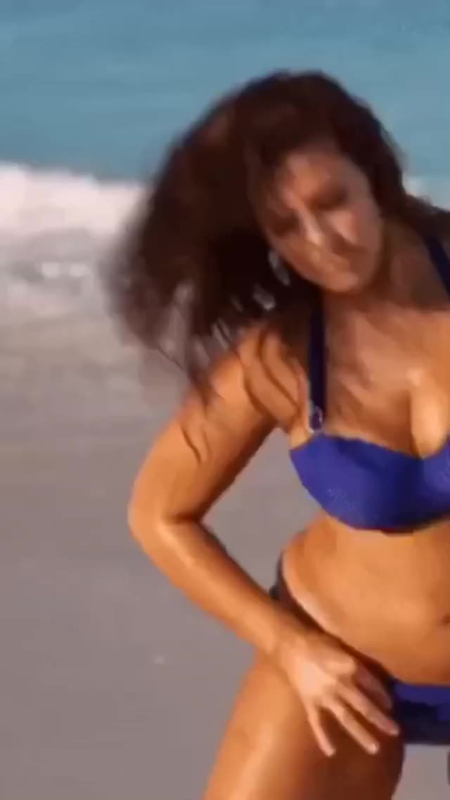 Ashley Graham shows off erotic curvy body in tight blue bikini on the beach