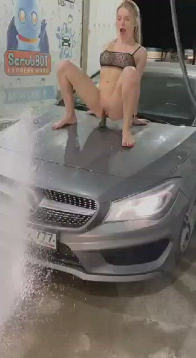 dildo riding on tp of car in car wash