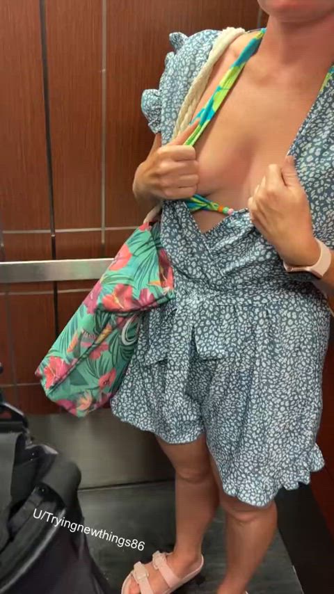 Flashing her tits on an elevator