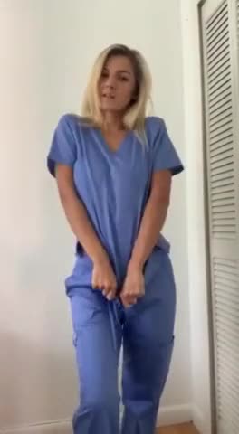 Blonde nurse removes her top