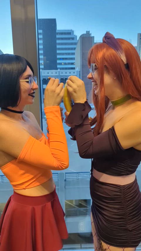 Velma and Daphne show off how far they can deep throat bananas... along with the