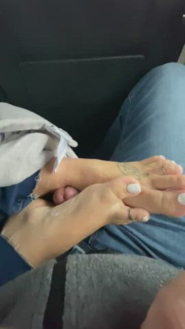 Sneaky footjob in the back of a packed van on our road trip!