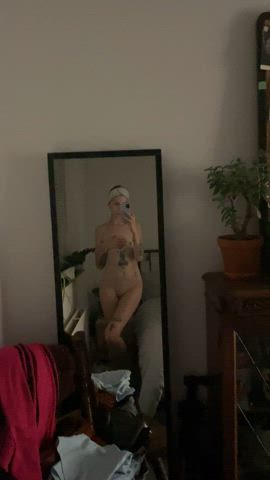 Petite figure in the mirror