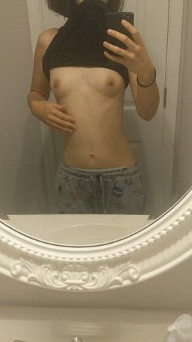 Tiny tits in someone's bathroom