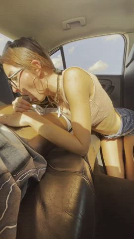 Cute girl with glasses swallows a BBC in the backseat of car
