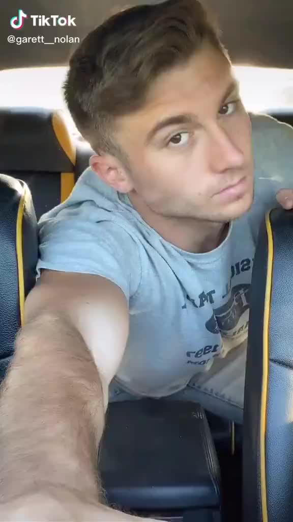 Garrett Nolan stripping in the back of a car