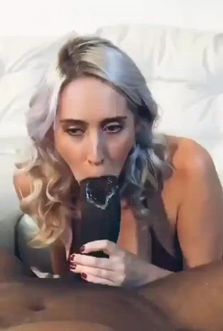 Sexy white girl sucking on a humongous black cock I’d love to see that monster