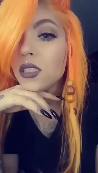 Sexy inked slut shows off her split tongue