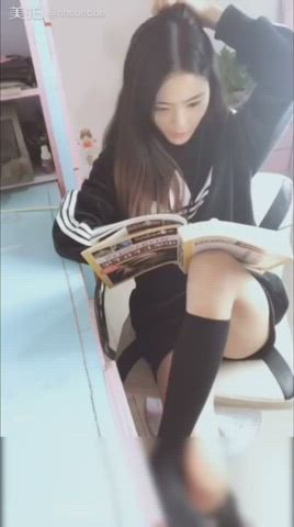 Chinese schoolgirl takes a break from studying..