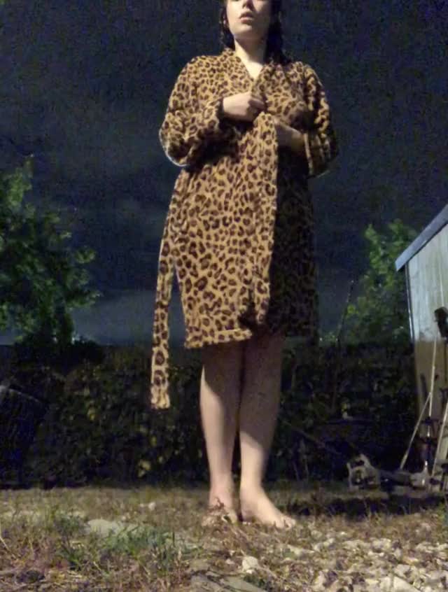 Stripping nude in my apartment backyard. There’s a parking lot light that makes