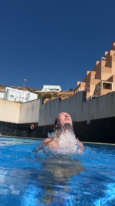 Topless jump from water in slow motion, revealing everything