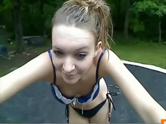 Teen girl stripping on trampoline