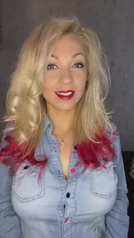 Cute blonde wanted to show off her denim shirt with black and pink snap buttons