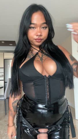 This busty asian queen is tightly strapped in and wearing her favourite latex outfit