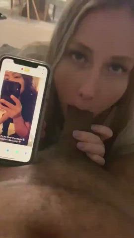Hotwife sucks her bull while he looks for the next piece of meat on Tinder.