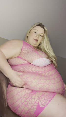 Plump mermaid caught in a pink fishing net