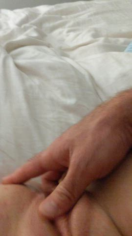 Rubbing her pussy with a finger in the ass